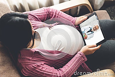 Doctor telemedicine service online video with pregnant woman for prenatal care Stock Photo