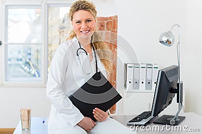 Doctor with test result in document or dossier Stock Photo