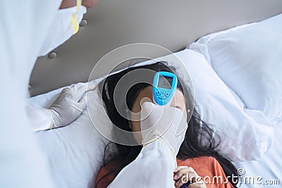 Doctor with thermometer checking child temperature Stock Photo