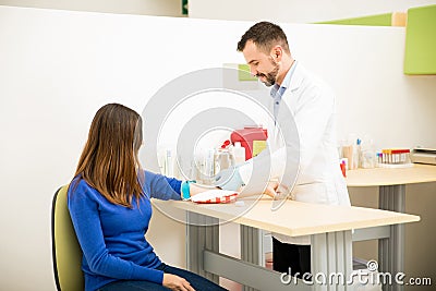 Doctor about to draw blood from patient Stock Photo