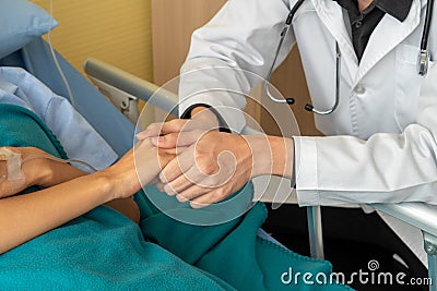 The doctor took care of the patient`s hands carefully. For encouragement and hope Stock Photo