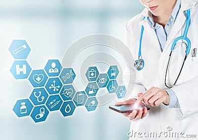 Doctor touching medical buttons on mobile Stock Photo