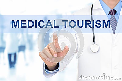 Doctor touching MEDICAL TOURISM sign on virtual screen Stock Photo