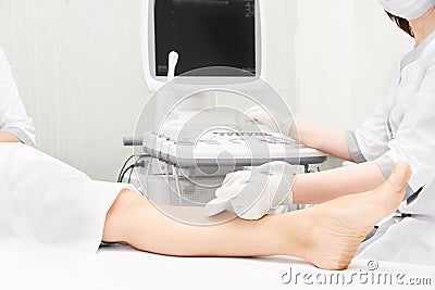 Doctor ultrasound knee test. Scan medical equipment. Diagnosis ultrasound foot Stock Photo