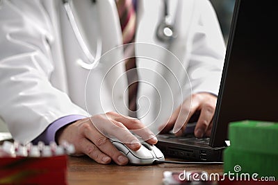 Doctor using computer Stock Photo