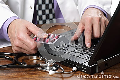 Doctor using computer Stock Photo