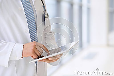 Doctor using a digital tablet, close-up of hands. Health care concept Stock Photo