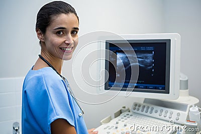 Doctor using sonography machine in hospital Stock Photo