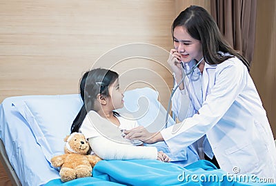 Doctor using stethoscope for examining a little kid Stock Photo