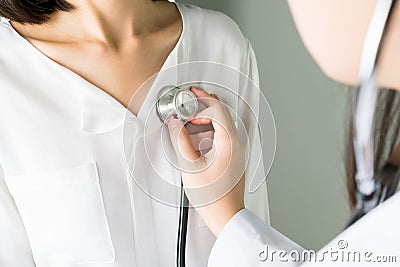 Doctor is using a stethoscope for patients patient examination. To hear the heart rate, For patients with heart disease. Stock Photo