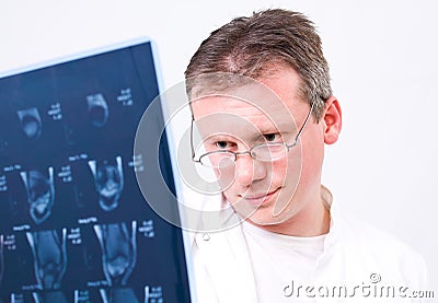 Doctor viewing MRI scans Stock Photo