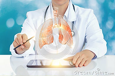 The doctor on the virtual screen shows a model of a human lung. Stock Photo