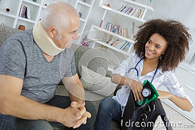 Doctor visit to elderly patient Stock Photo