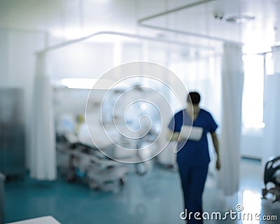 Doctor walking in the ICU, unfocused background Stock Photo