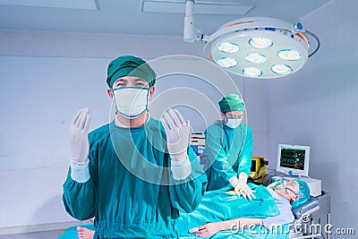 doctor wear glove and ready to save patient under lighting Stock Photo