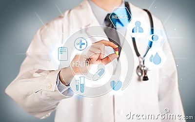 A doctor in white holding a pill Stock Photo