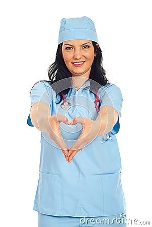 Doctor woman forming heart shape Stock Photo