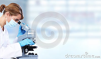 Doctor woman with microscope. Stock Photo