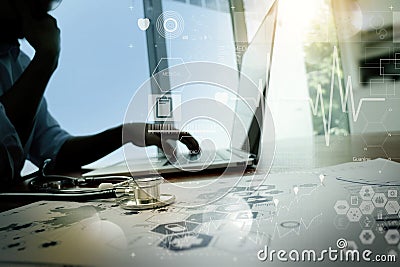 Doctor working with laptop computer in medical workspace office Stock Photo