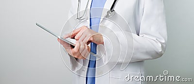 Doctor working with modern digital tablet and computer for medical network telecommunication to consult and prescribe medicine Stock Photo