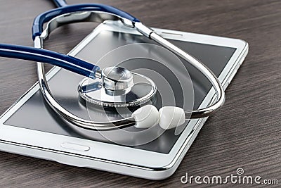 Doctor workplace with digital tablet and stethoscope Stock Photo