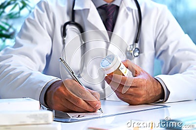 Doctor writing out RX prescription Stock Photo