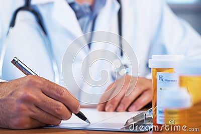 Doctor writing RX prescription Stock Photo