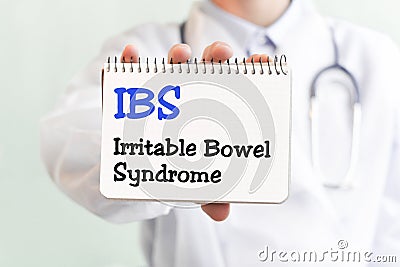 Doctor writing word IBS Irritable Bowel Syndrome with marker, Medical concept Stock Photo