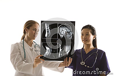 Doctors analyzing x-ray. Stock Photo