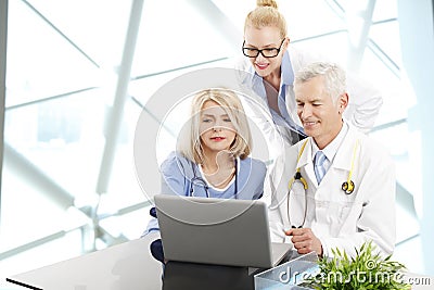 Doctors consulting at hospital Stock Photo