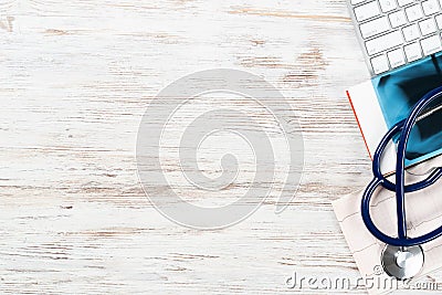 Doctors desktop with medical supplies Stock Photo