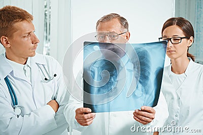 Doctors examine x-ray image Stock Photo