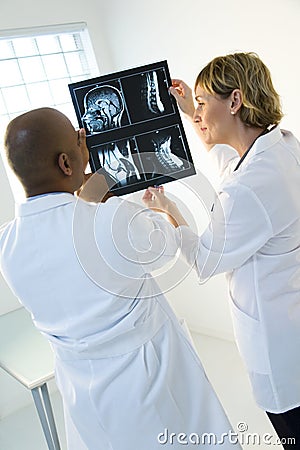 Doctors examining x-ray Stock Photo