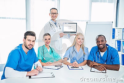 team of doctors and general practitioner with laptop Editorial Stock Photo