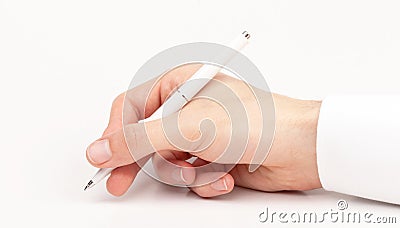 Doctors hand writing using a white pen, closeup, gesture isolated on white. Medical personnel, doctor holding a pen writing Stock Photo