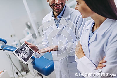 Doctors looking at digital tablet screen with x-ray Stock Photo