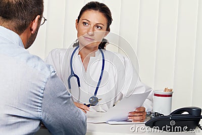 Doctors in medical practice with patients. Stock Photo