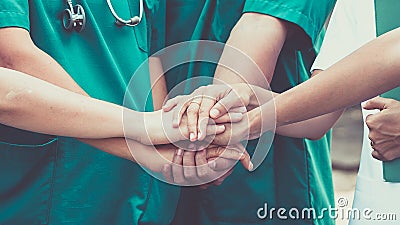 Doctors and nurses coordinate hands Stock Photo