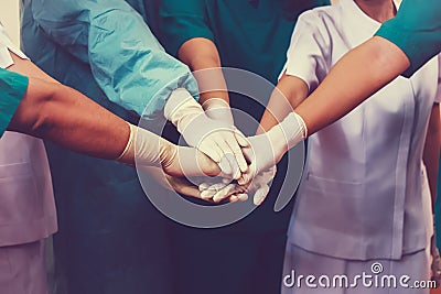 Doctors and nurses coordinate hands Stock Photo