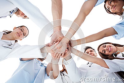 Doctors and nurses stacking hands Stock Photo