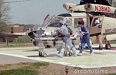 Hospital personnel rush a severely injured man Editorial Stock Photo