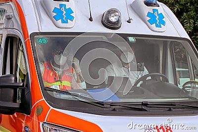 Doctors with protective mask inside an Italian ambulance Editorial Stock Photo