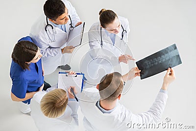 Doctors with spine x-ray and clipboards Stock Photo