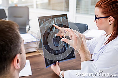 Doctors team having medical council in hospital. Spine fixation systems Stock Photo