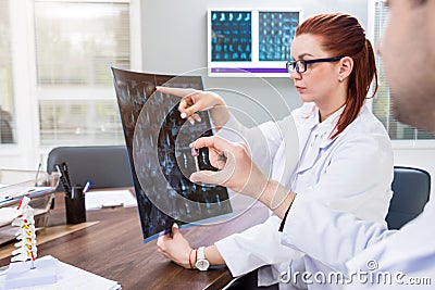 Doctors team having medical council in hospital. Spine fixation systems Stock Photo