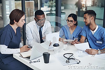 Doctors, teamwork and planning for healthcare in office with laptop, documents and research. Nurses, collaboration and Stock Photo