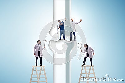 Doctors treating the bone joint Stock Photo