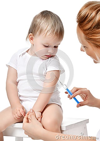 Doctors woman hand with syringe vaccinating child baby flu injection shot isolated on a white Stock Photo