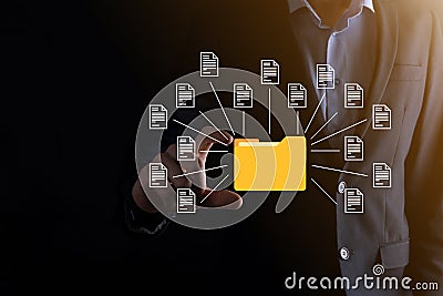 Document Management System DMS .Businessman hold folder and document icon.Software for archiving, searching and managing corporate Stock Photo