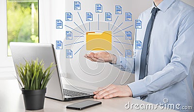 Document Management System DMS .Businessman hold folder and document icon.Software for archiving, searching and managing corporate Stock Photo